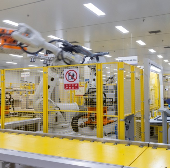 Industrial robotic machinery in enclosure